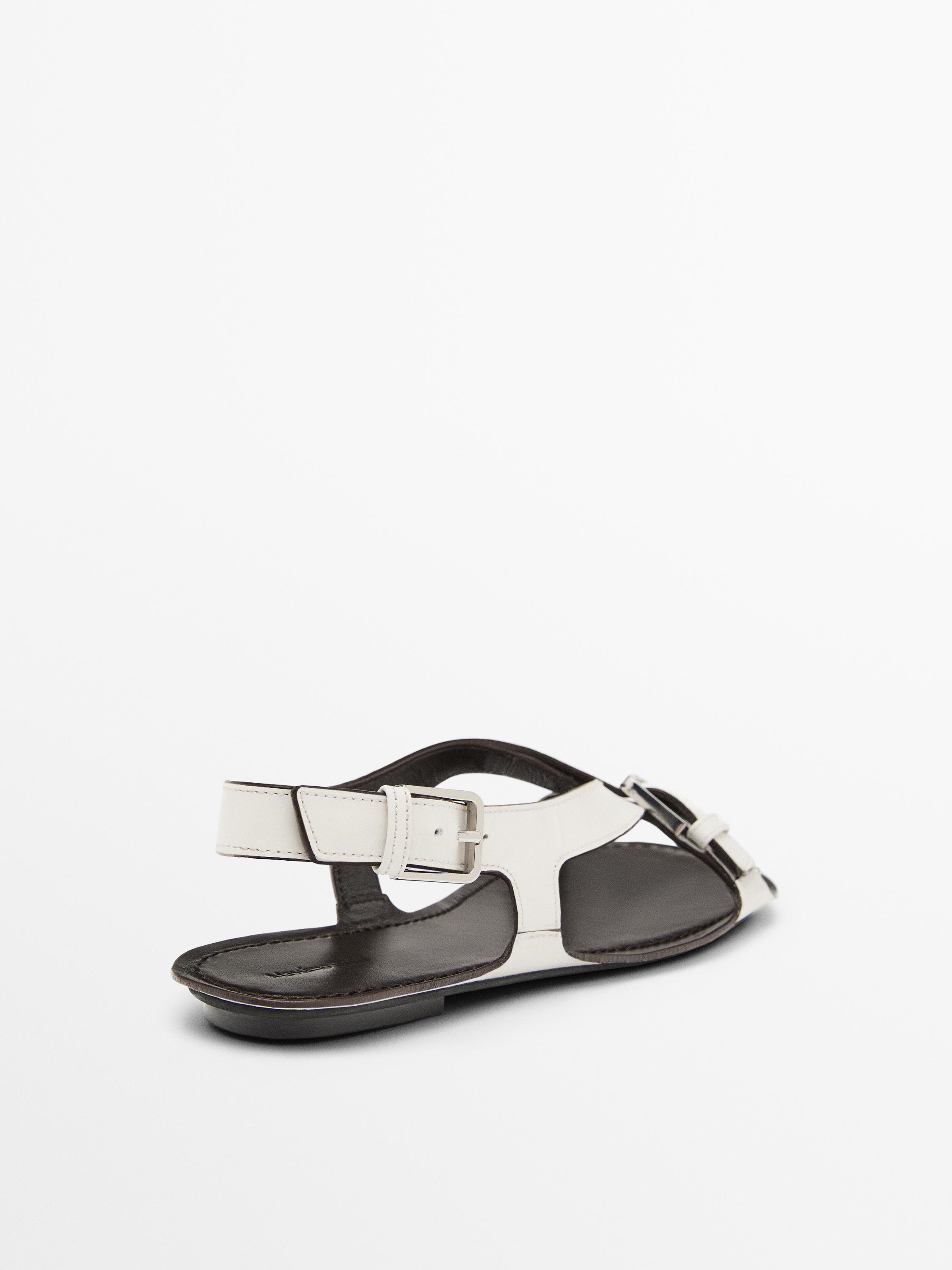 Flat leather sandals with buckles